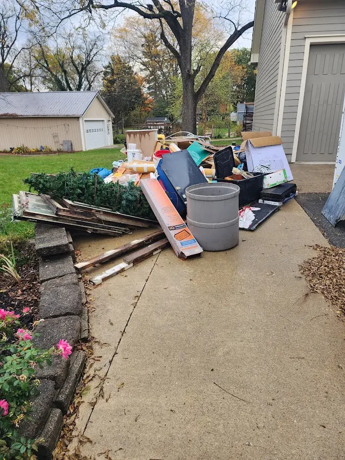 Dumpster being loaded with debris for 12 Yard Dumpster Rental in Terrell Hills